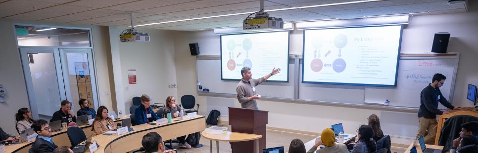 Ned Spang talking to students in classroom