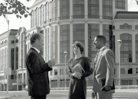 Dean Robert Smiley talking with students outside of One Capital Mall