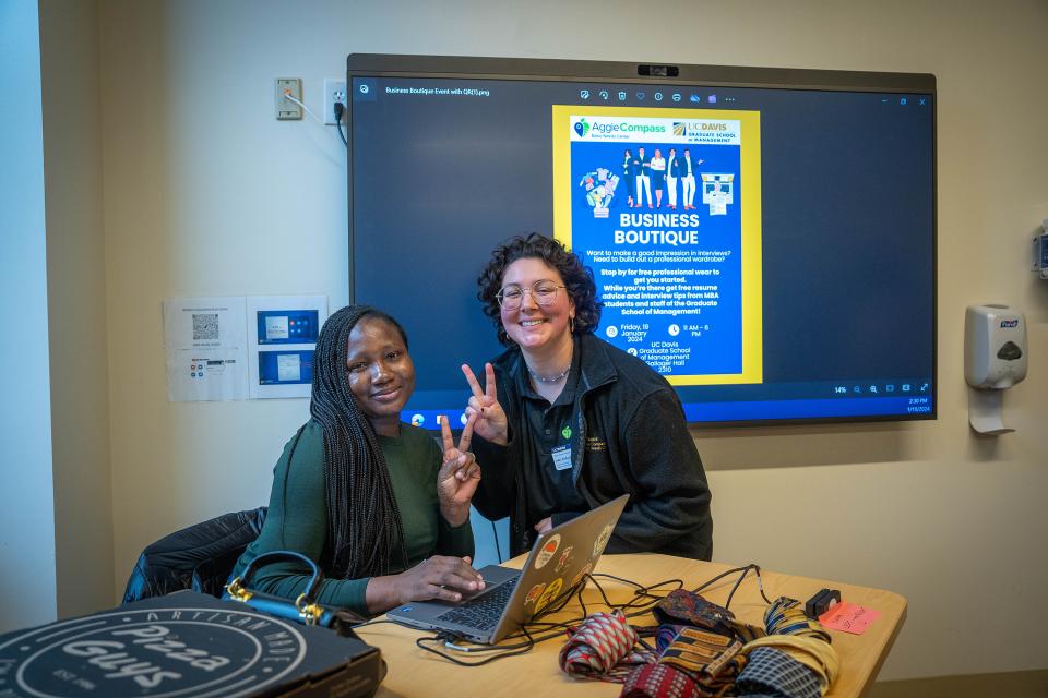 Temidire Dada and Julia Hollard in conference room in Gallagher Hall