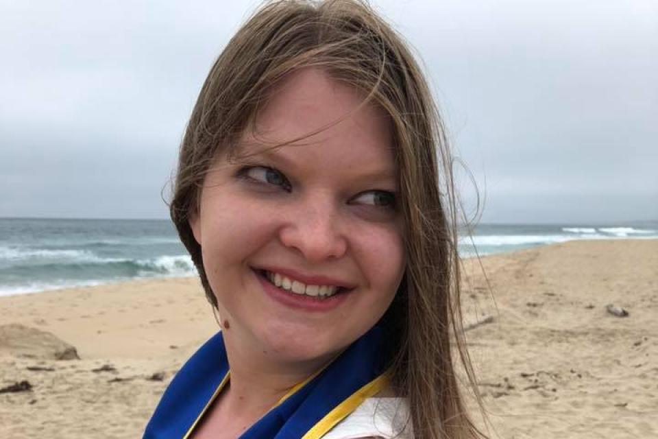 Kristy Pahel MPAc 21 graduation photo on the beach