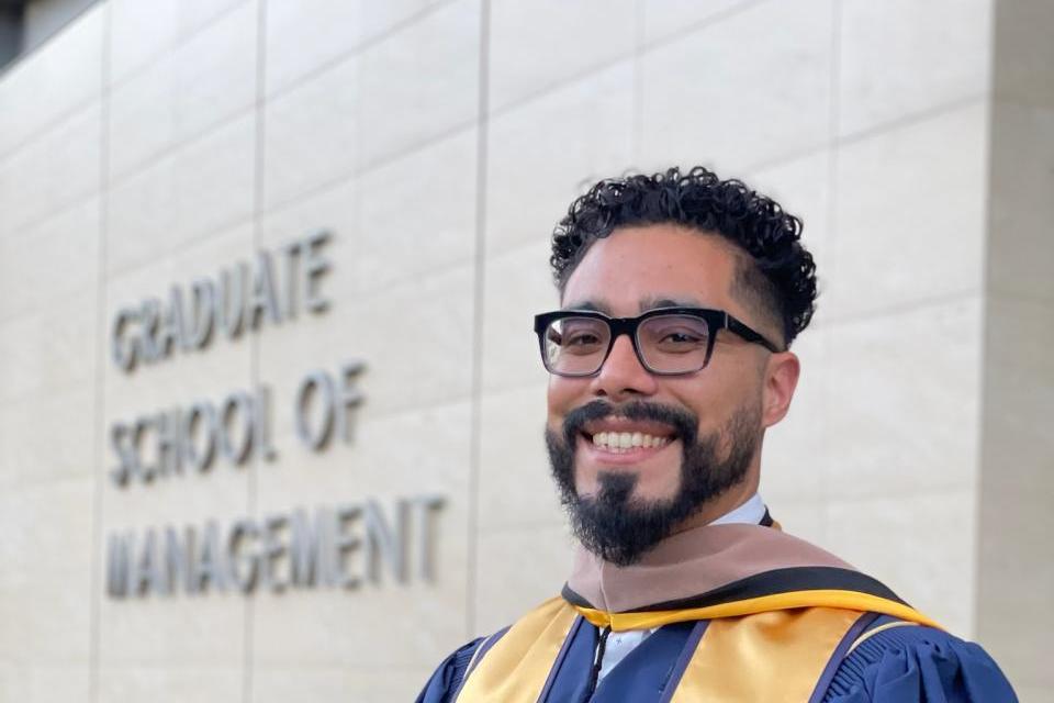 Antonio Hurtado standing in front of Gallagher Hall