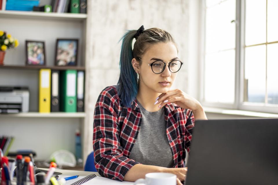 woman looking at laptop